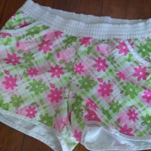 White athletic material shorts with a pattern